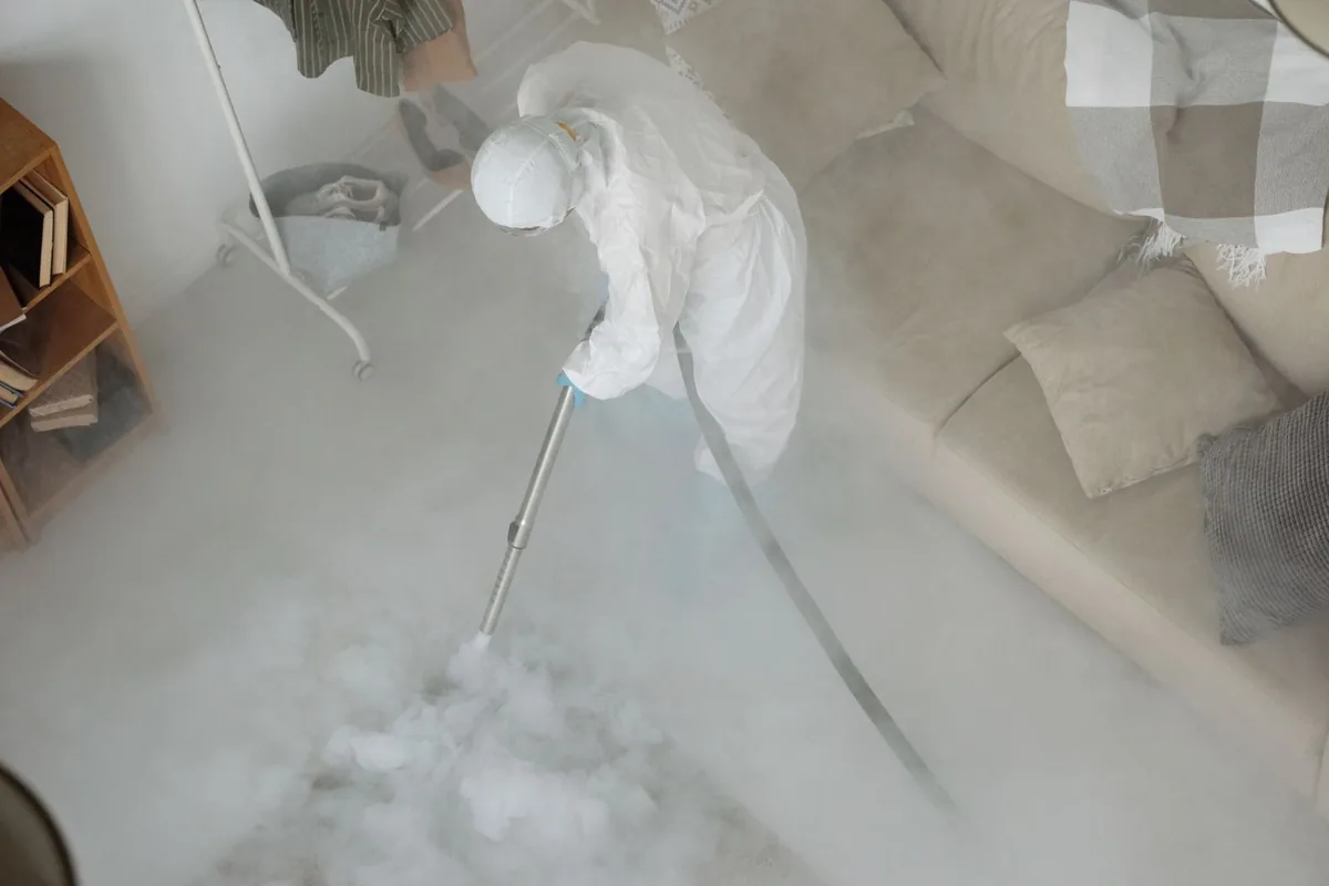 Biohazard cleanup technician in protective equipment, Jensen Beach, FL